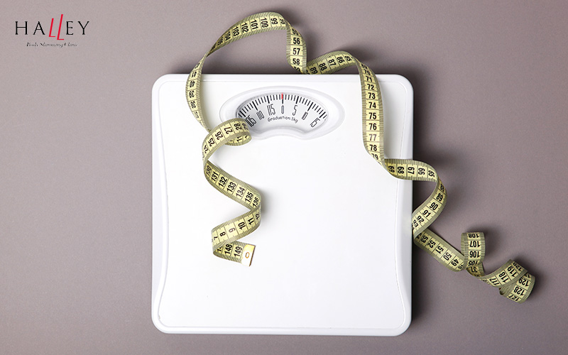 A weighing scale and a measuring tape.
