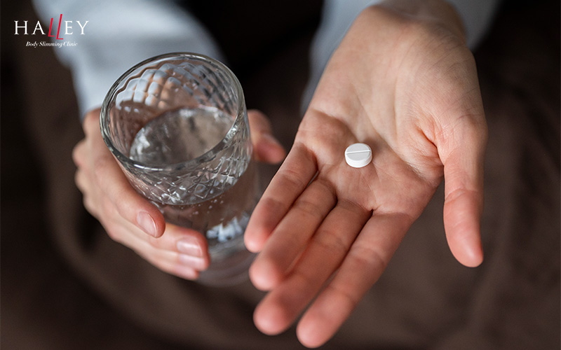 Patient taking oral medication for clinical male weight management.