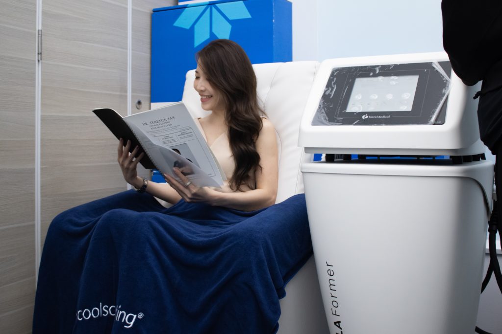 Woman on Tesla Muscle Former chair for pelvic floor strengthening.
